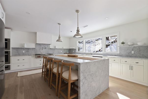 Interior, Kitchen, Marble Walls, Pendant Lights, Recessed Lighting, Stainless Steel Appliances, Wood Texture Flooring