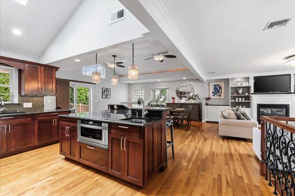 Dining room, Fireplace, Interior, Kitchen, Living room, Pendant Lights, Recessed Lighting, Stainless Steel Appliances, Wood Texture Flooring