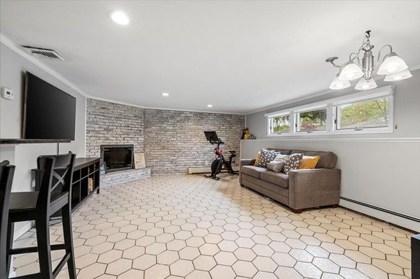Chandelier, Fireplace, Fitness Equipment, Interior, Recessed Lighting, Stone Walls