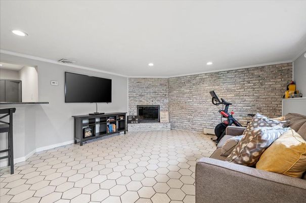 Fireplace, Fitness Equipment, Interior, Recessed Lighting, Stone Walls