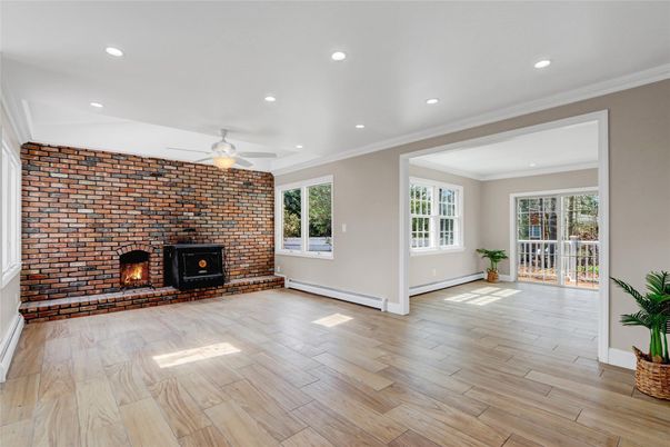 Empty room, Fireplace, Interior, Recessed Lighting, Stone Walls, Wood Texture Flooring