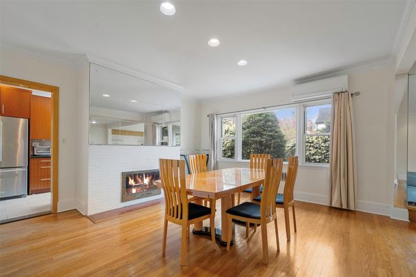 Dining room, Fireplace, Interior, Kitchen, Recessed Lighting, Stainless Steel Appliances, Wood Texture Flooring