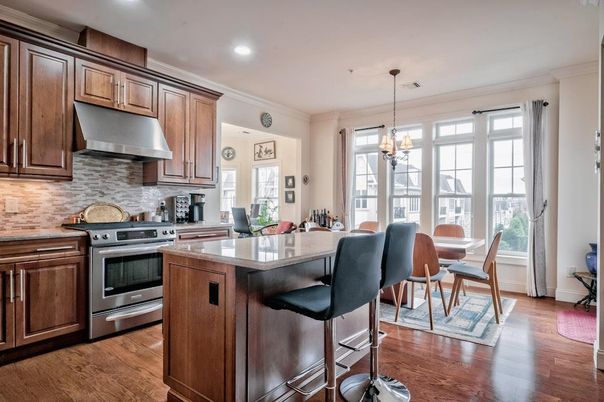 Dining room, Interior, Kitchen, Pendant Lights, Recessed Lighting, Stainless Steel Appliances, Wood Texture Flooring