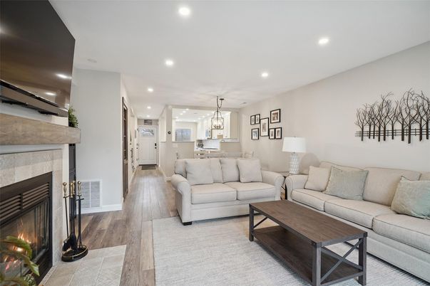 Dining room, Fireplace, Interior, Kitchen, Living room, Pendant Lights, Recessed Lighting, Stainless Steel Appliances, Wood Texture Flooring