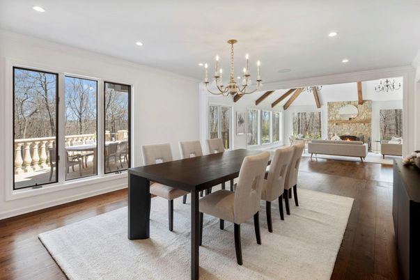 Chandelier, Dining room, Fireplace, Interior, Living room, Pendant Lights, Recessed Lighting, Wood Texture Flooring