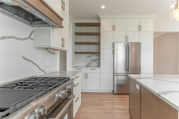 Interior, Kitchen, Marble Walls, Recessed Lighting, Stainless Steel Appliances, Wood Texture Flooring