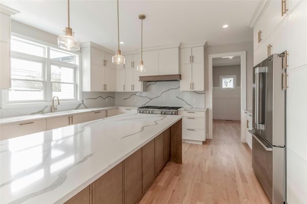 Interior, Kitchen, Marble Walls, Pendant Lights, Recessed Lighting, Stainless Steel Appliances, Wood Texture Flooring