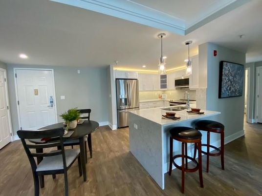 Dining room, Interior, Kitchen, Pendant Lights, Recessed Lighting, Stainless Steel Appliances, Wood Texture Flooring