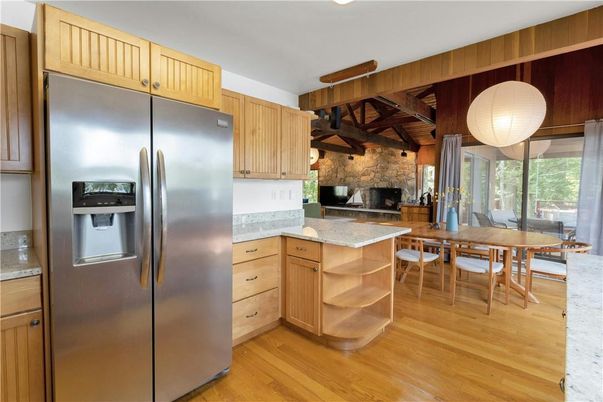 Dining room, Fireplace, Interior, Kitchen, Stainless Steel Appliances, Stone Walls, Wood Texture Flooring