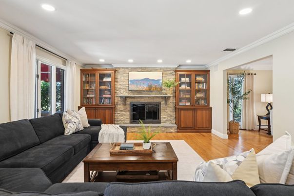 Fireplace, Interior, Living room, Recessed Lighting, Stone Walls, Wood Texture Flooring