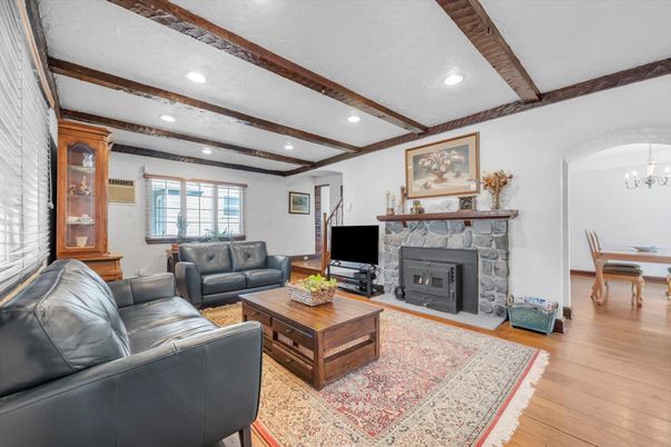 Chandelier, Dining room, Fireplace, Interior, Living room, Recessed Lighting, Wooden Beams, Wood Texture Flooring