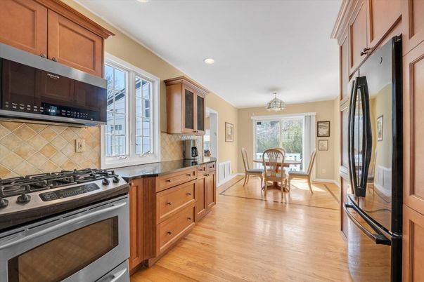 Chandelier, Dining room, Interior, Kitchen, Recessed Lighting, Stainless Steel Appliances, Wood Texture Flooring