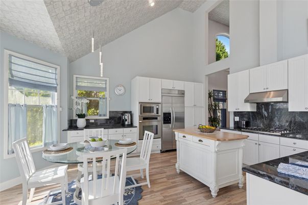 Dining room, Interior, Kitchen, Recessed Lighting, Stainless Steel Appliances, Wood Texture Flooring
