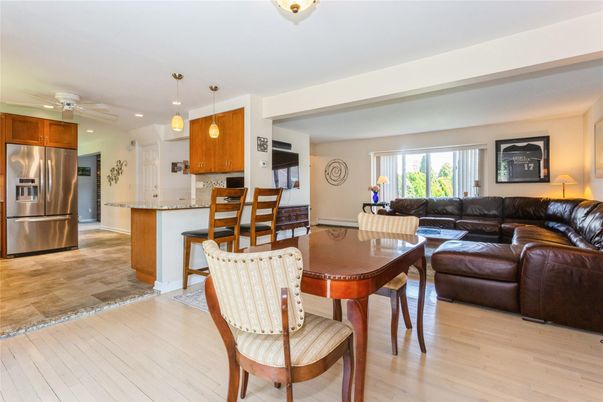 Dining room, Interior, Kitchen, Living room, Pendant Lights, Recessed Lighting, Stainless Steel Appliances, Wood Texture Flooring