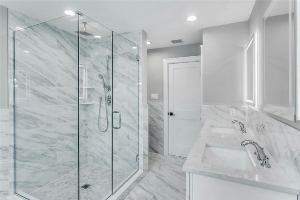Bathroom, Dual Sink Vanities, Glass Shower, Interior, Marble, Marble Walls, Recessed Lighting