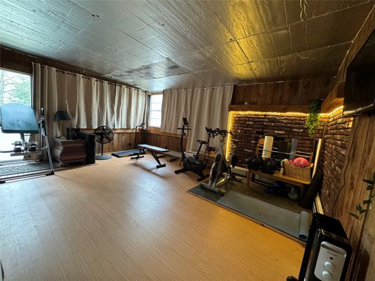 Fireplace, Fitness Equipment, Interior, Stone Walls, Wooden Ceilings, Wood Texture Flooring