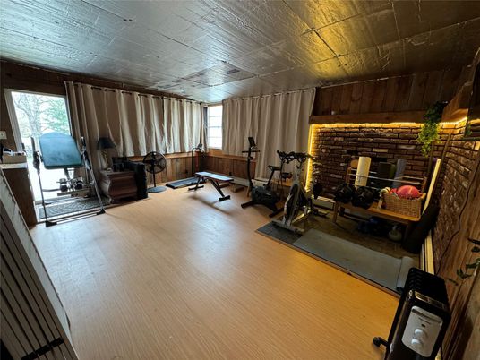 Fireplace, Fitness Equipment, Interior, Stone Walls, Wooden Ceilings, Wood Texture Flooring
