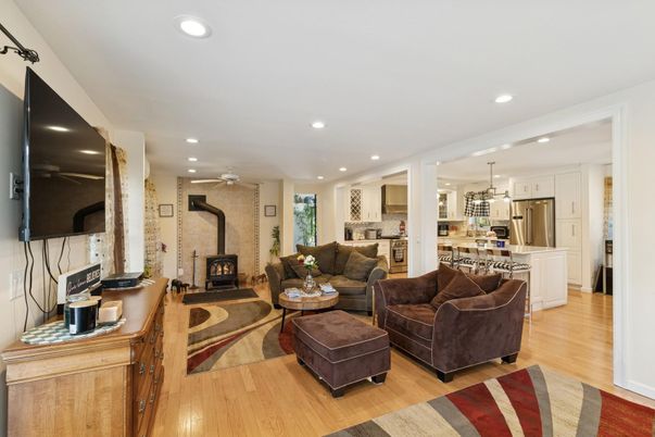 Dining room, Fireplace, Interior, Kitchen, Living room, Pendant Lights, Recessed Lighting, Stainless Steel Appliances, Wood Texture Flooring
