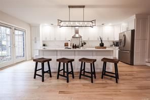 Chandelier, Interior, Kitchen, Pendant Lights, Recessed Lighting, Stainless Steel Appliances, Wood Texture Flooring