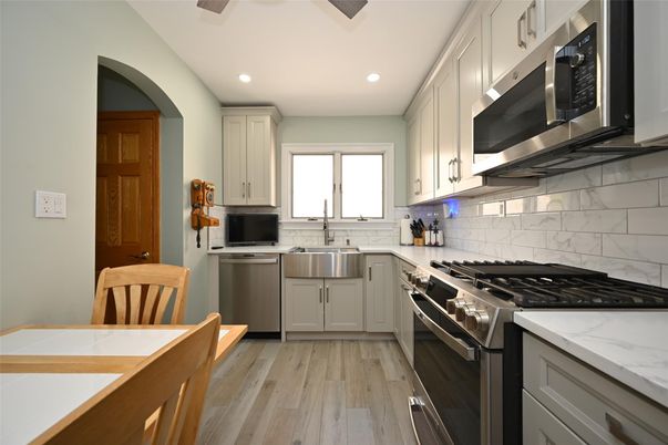 Interior, Kitchen, Recessed Lighting, Stainless Steel Appliances, Wood Texture Flooring