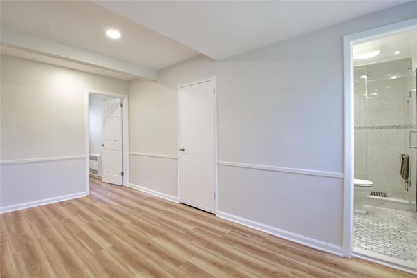 Bathroom, Empty room, Glass Shower, Interior, Recessed Lighting, Wood Texture Flooring