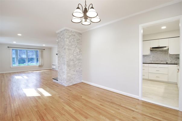 Empty room, Interior, Kitchen, Pendant Lights, Recessed Lighting, Stainless Steel Appliances, Wood Texture Flooring