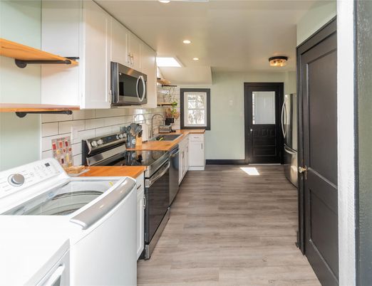 Interior, Kitchen, Recessed Lighting, Washer, Wood Texture Flooring