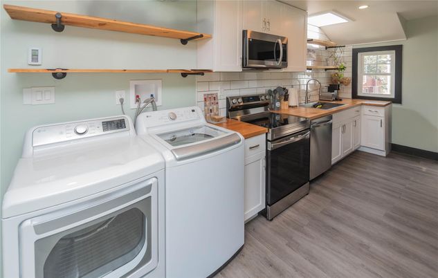 Interior, Kitchen, Recessed Lighting, Washer, Wood Texture Flooring