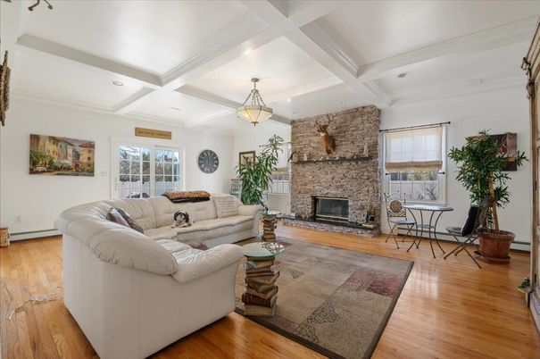 Fireplace, Interior, Living room, Pendant Lights, Recessed Lighting, Stone Walls, Wood Texture Flooring