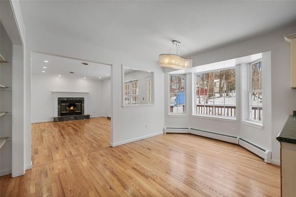Chandelier, Empty room, Fireplace, Interior, Recessed Lighting, Wood Texture Flooring
