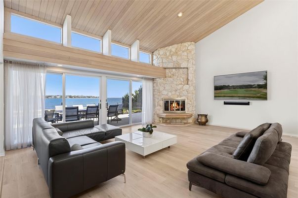 Fireplace, Interior, Living room, Recessed Lighting, Stone Walls, Water, Wooden Ceilings, Wood Texture Flooring