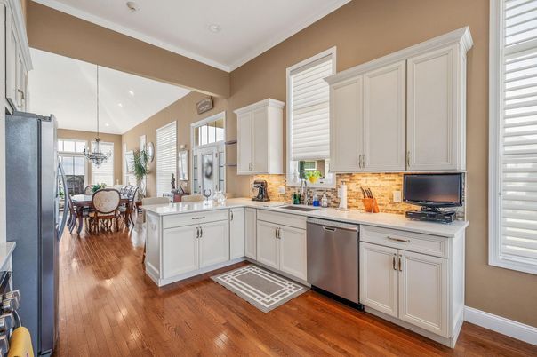 Chandelier, Dining room, Interior, Kitchen, Recessed Lighting, Stainless Steel Appliances, Wood Texture Flooring