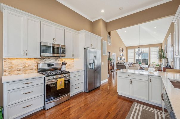 Chandelier, Dining room, Interior, Kitchen, Pendant Lights, Recessed Lighting, Stainless Steel Appliances, Wood Texture Flooring
