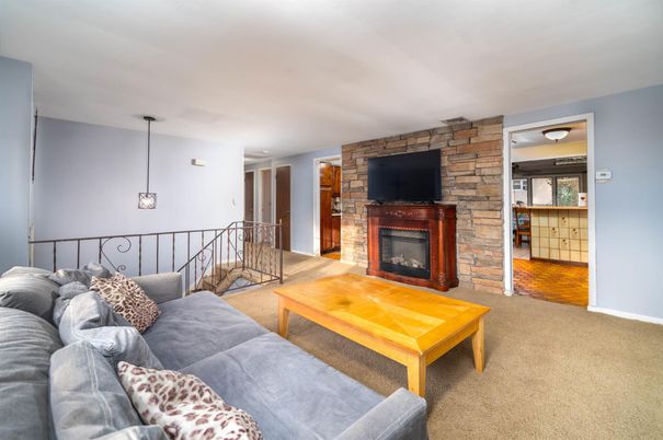 Fireplace, Interior, Living room, Pendant Lights, Stone Walls, Wood Texture Flooring