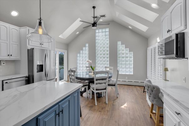Dining room, Interior, Kitchen, Pendant Lights, Recessed Lighting, Stainless Steel Appliances, Wood Texture Flooring