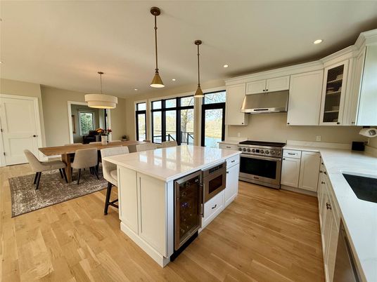 Dining room, Interior, Kitchen, Pendant Lights, Recessed Lighting, Stainless Steel Appliances, Wood Texture Flooring