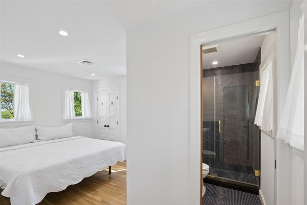 Bathroom, Bedroom, Glass Shower, Interior, Recessed Lighting, Wood Texture Flooring