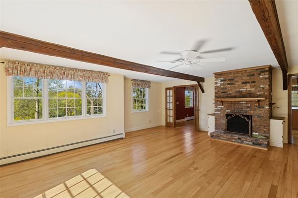 Empty room, Fireplace, Interior, Stone Walls, Wooden Beams, Wood Texture Flooring