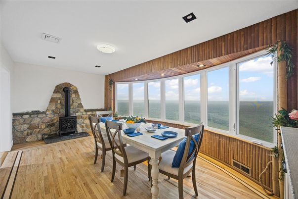 Dining room, Fireplace, Interior, Recessed Lighting, Water, Wood Texture Flooring