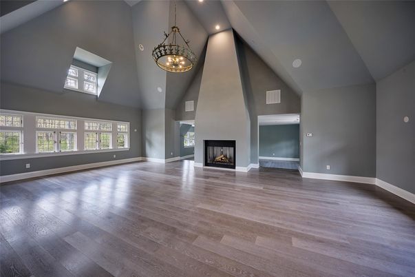 Chandelier, Empty room, Fireplace, Interior, Pendant Lights, Recessed Lighting, Wood Texture Flooring