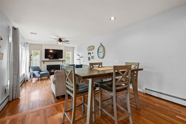 Dining room, Fireplace, Interior, Living room, Recessed Lighting, Wood Texture Flooring
