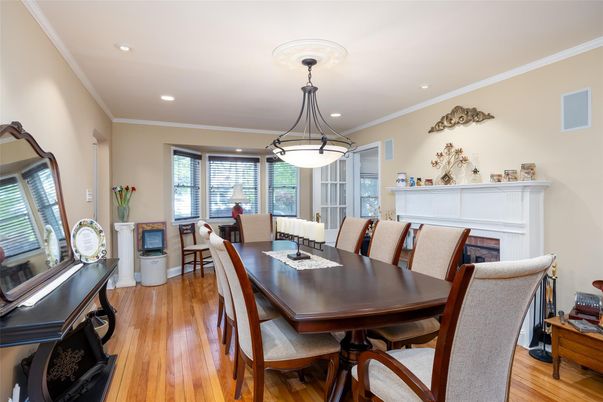 Dining room, Fireplace, Interior, Living room, Pendant Lights, Recessed Lighting, Wood Texture Flooring