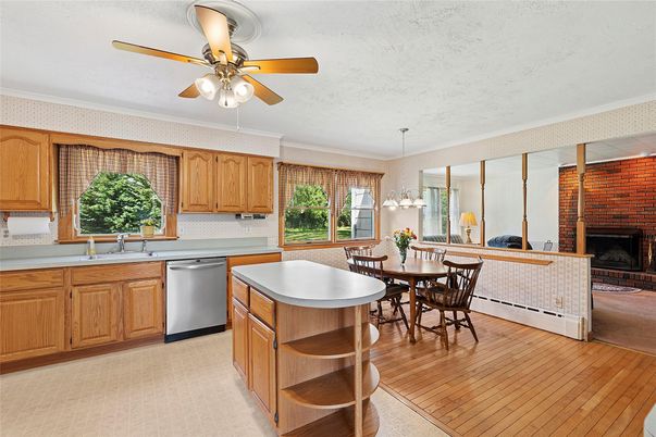 Dining room, Fireplace, Interior, Kitchen, Pendant Lights, Stone Walls, Wood Texture Flooring