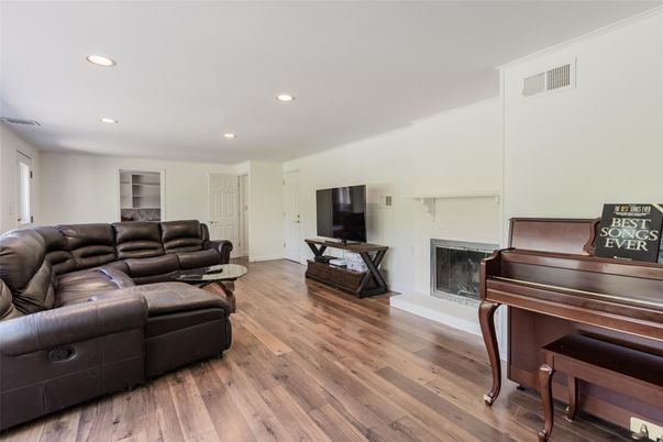 Fireplace, Interior, Living room, Piano, Recessed Lighting, Wood Texture Flooring