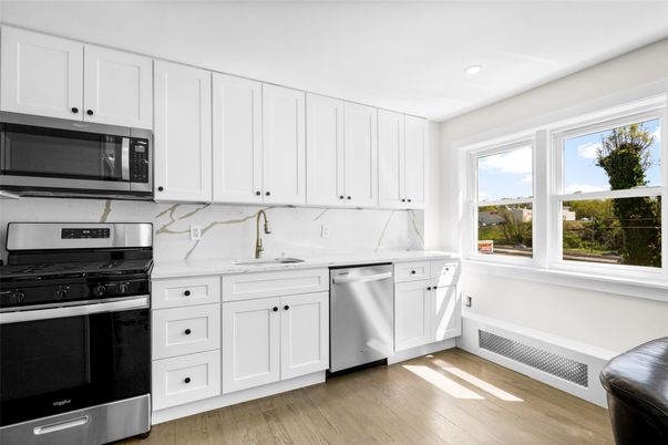 Interior, Kitchen, Marble Walls, Recessed Lighting, Stainless Steel Appliances, Wood Texture Flooring