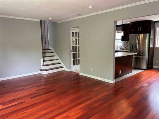 Empty room, Interior, Kitchen, Recessed Lighting, Stainless Steel Appliances, Wood Texture Flooring