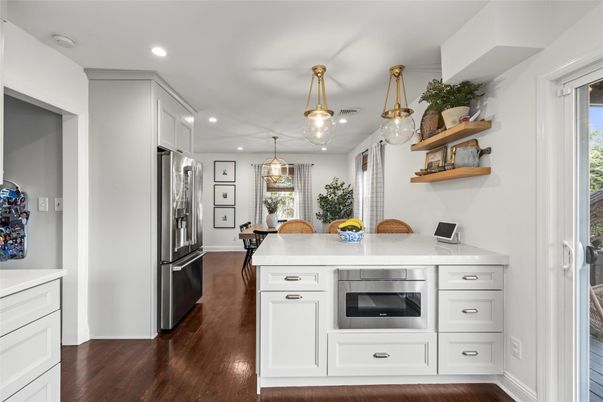 Dining room, Interior, Kitchen, Pendant Lights, Recessed Lighting, Stainless Steel Appliances, Wood Texture Flooring