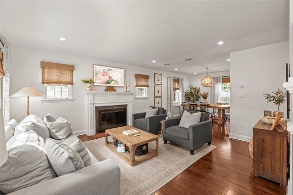 Chandelier, Dining room, Fireplace, Interior, Living room, Pendant Lights, Recessed Lighting, Wood Texture Flooring