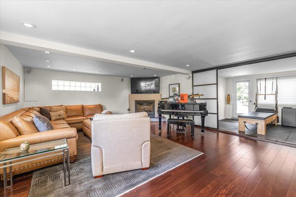 Fireplace, Interior, Living room, Piano, Recessed Lighting, Wood Texture Flooring