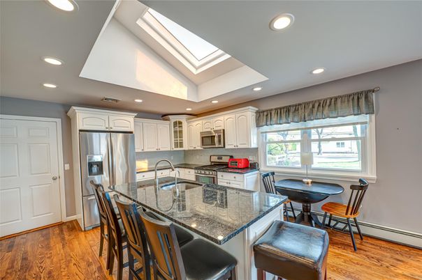 Dining room, Interior, Kitchen, Recessed Lighting, Stainless Steel Appliances, Wood Texture Flooring